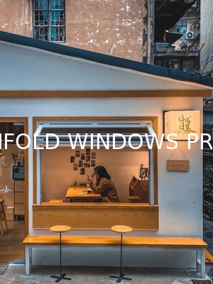 Orangery-Style Folding Window Reinterpretation Using Modern Materials for Historic Home Sympathy