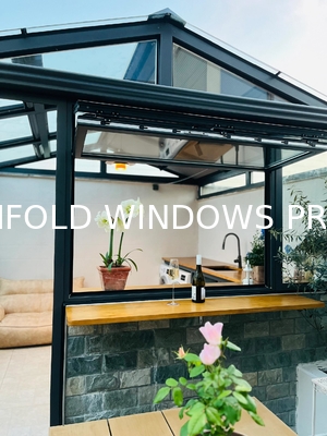 Wide-Angle Folding Window Assembly Creating Uninterrupted Garden Perspectives and Easy-Access Patio Connections