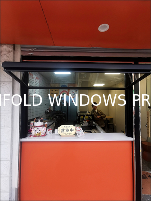 Wide-Format Folding Window Configuration Framing Mountain Vistas and Urban Skyline Views with Minimal Framework