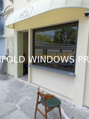 Wide-Format Folding Window Configuration Framing Mountain Vistas and Urban Skyline Views with Minimal Framework