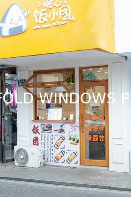 Cooking Station Folding Window Allowing Pass-Through Service to Outdoor Dining Areas During Entertaining
