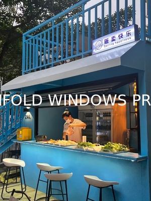 Cooking Station Folding Window Allowing Pass-Through Service to Outdoor Dining Areas During Entertaining