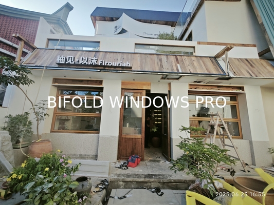 Water-Reflective Folding Window Design Amplifying Natural Light Through Strategic Shoreline Positioning