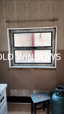 View Alpine Cabin Folding Window Framing Vertical Cliff Faces and Eagle Nesting Sites
